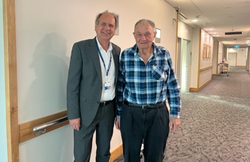 Dr Peter Hadjipetrou (fourth from right) with  Greenslopes Private Hospital executive members and cardiac theatre team