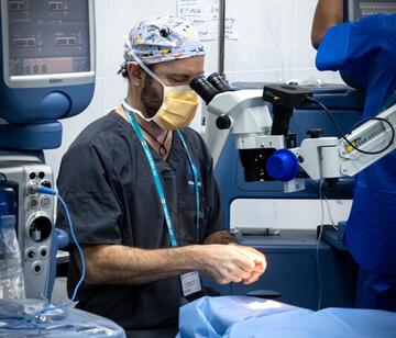 Dr Andrew Traill operating the donated eye care equipment during his trip to Cambodia